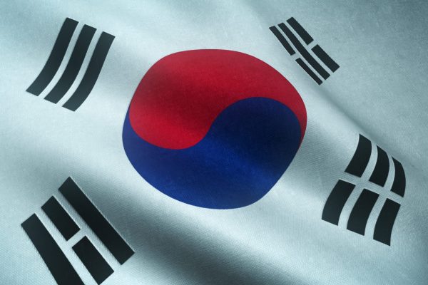 A closeup shot of the waving flag of South Korea with interesting textures